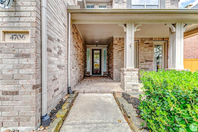 4706 Payton Chase Ln, Katy, TX 77494 - doorway to property featuring a porch and brick siding
