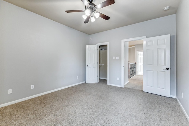 4706 Payton Chase Ln, Katy, TX 77494 - unfurnished bedroom featuring carpet floors, baseboards, a walk in closet, and ceiling fan