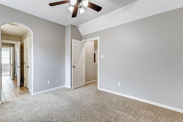 4706 Payton Chase Ln, Katy, TX 77494 - unfurnished bedroom featuring arched walkways, light carpet, baseboards, and ceiling fan