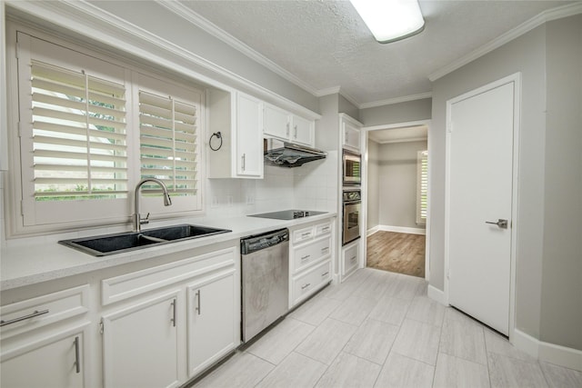 2706 Williams Grant St, Sugar Land, TX 77479 - kitchen featuring stainless steel appliances, a sink, plenty of natural light, white cabinets, and a textured ceiling