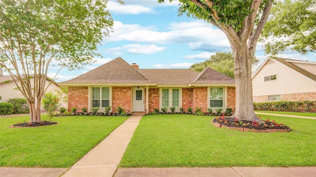 2706 Williams Grant St, Sugar Land, TX 77479 - view of front facade featuring a front yard and brick siding
