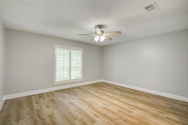 2706 Williams Grant St, Sugar Land, TX 77479 - spare room featuring ceiling fan, wood finished floors, baseboards, and a textured ceiling