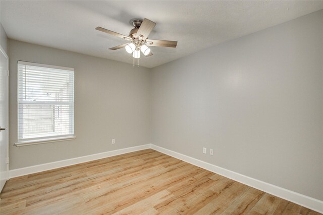 2706 Williams Grant St, Sugar Land, TX 77479 - unfurnished room with baseboards, light wood-style flooring, and ceiling fan