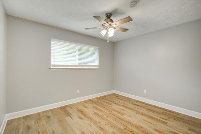2706 Williams Grant St, Sugar Land, TX 77479 - unfurnished room featuring a smoke detector, baseboards, wood finished floors, and ceiling fan