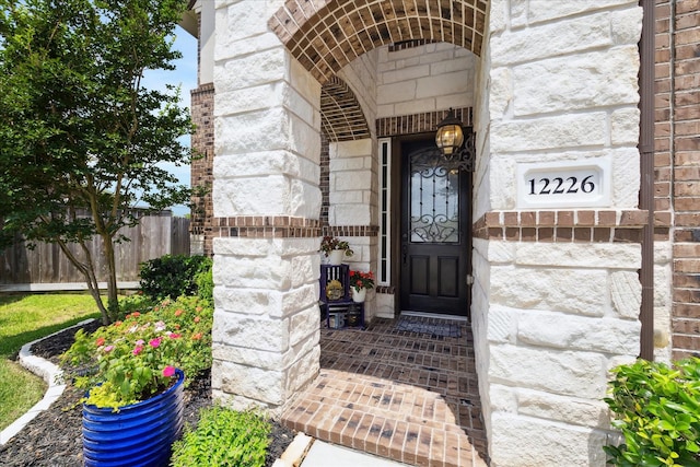 12226 Brighton Brook Ln, Tomball, TX 77377 - view of exterior entry with stone siding and brick siding