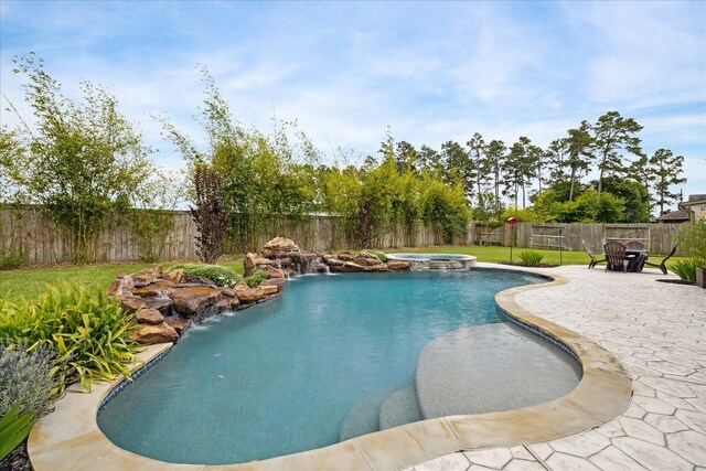 12226 Brighton Brook Ln, Tomball, TX 77377 - view of swimming pool with a fenced backyard, a patio area, and a pool with connected hot tub