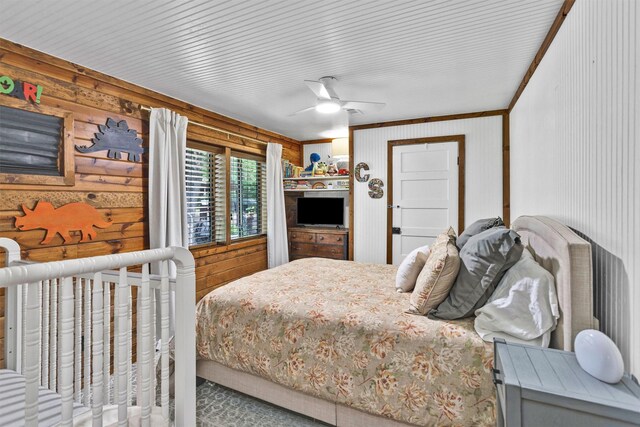 1356 Pegoda Ranch Rd, Woodlake, TX 75865 - bedroom with crown molding, wooden walls, and ceiling fan