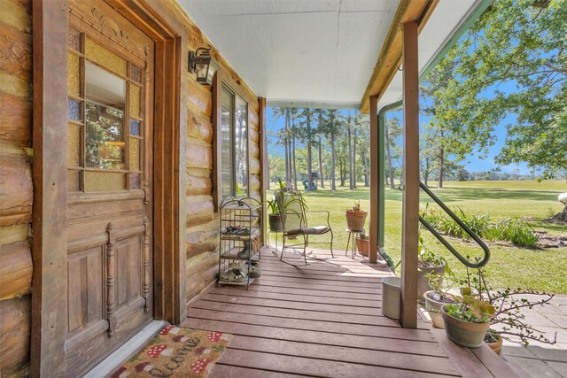 1356 Pegoda Ranch Rd, Woodlake, TX 75865 - porch featuring a lawn