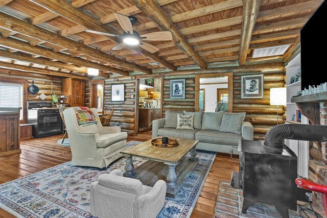 1356 Pegoda Ranch Rd, Woodlake, TX 75865 - living area featuring rustic walls, wood ceiling with exposed beams, hardwood / wood-style flooring, and a ceiling fan
