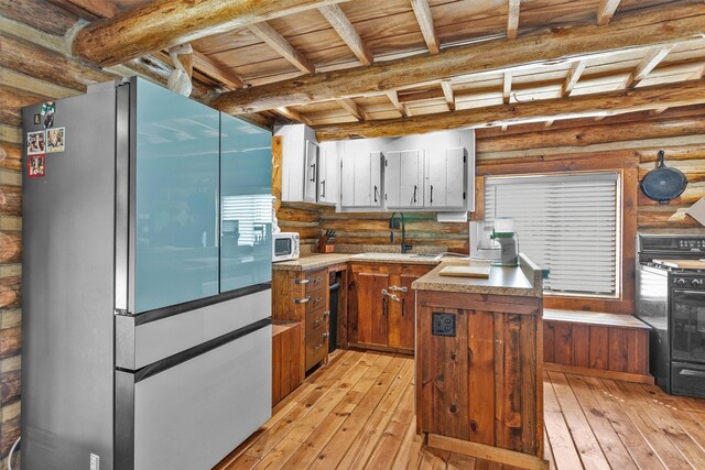 1356 Pegoda Ranch Rd, Woodlake, TX 75865 - kitchen with smart refrigerator, a sink, white microwave, light wood-style floors, and stove