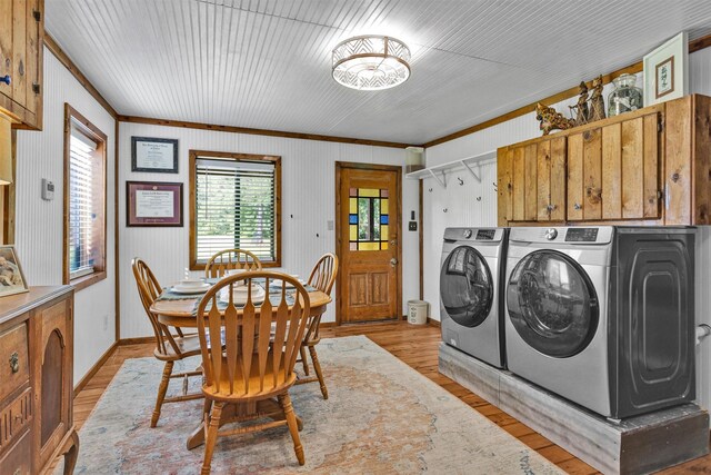 1356 Pegoda Ranch Rd, Woodlake, TX 75865 - dining room with washer and clothes dryer, crown molding, light wood-type flooring, and baseboards