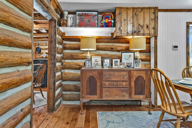 1356 Pegoda Ranch Rd, Woodlake, TX 75865 - office with hardwood / wood-style flooring and rustic walls
