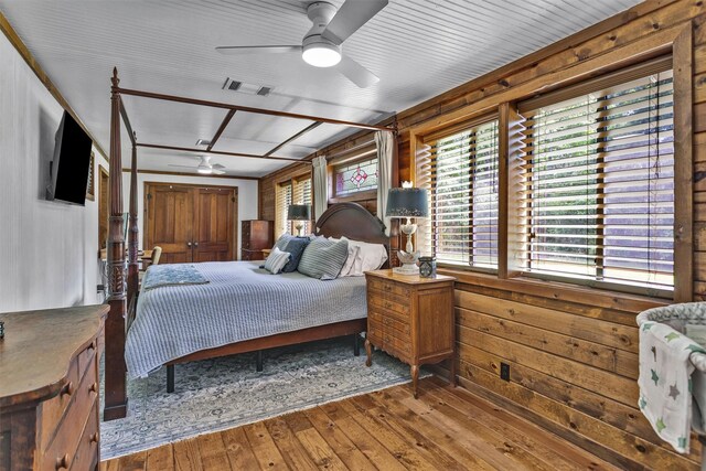 1356 Pegoda Ranch Rd, Woodlake, TX 75865 - bedroom featuring hardwood / wood-style floors and wood walls