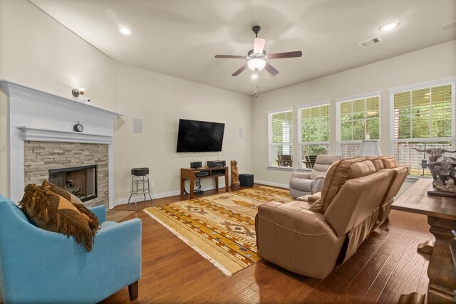 143 Jacks Corner Dr, Montgomery, TX 77316 - living room featuring a ceiling fan, baseboards, wood finished floors, a stone fireplace, and recessed lighting