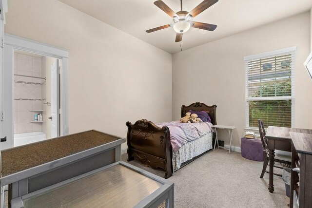 143 Jacks Corner Dr, Montgomery, TX 77316 - bedroom featuring light colored carpet, baseboards, ceiling fan, and ensuite bath