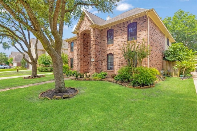 4910 Bayfair St, Pasadena, TX 77505 - view of front of property with brick siding and a front lawn