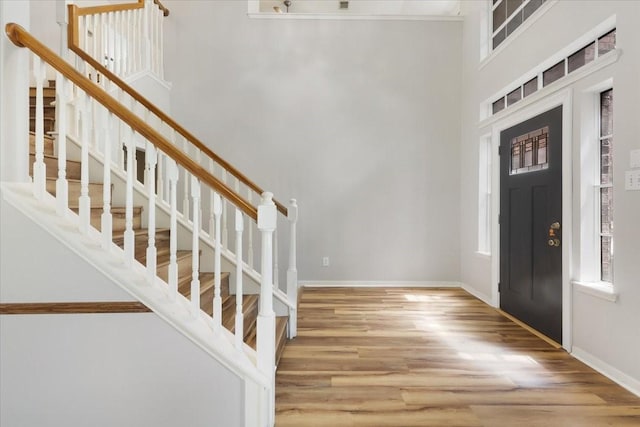 4910 Bayfair St, Pasadena, TX 77505 - foyer entrance with wood finished floors, stairway, and a towering ceiling