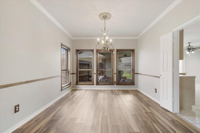 4910 Bayfair St, Pasadena, TX 77505 - unfurnished dining area featuring a chandelier, wood finished floors, and ornamental molding