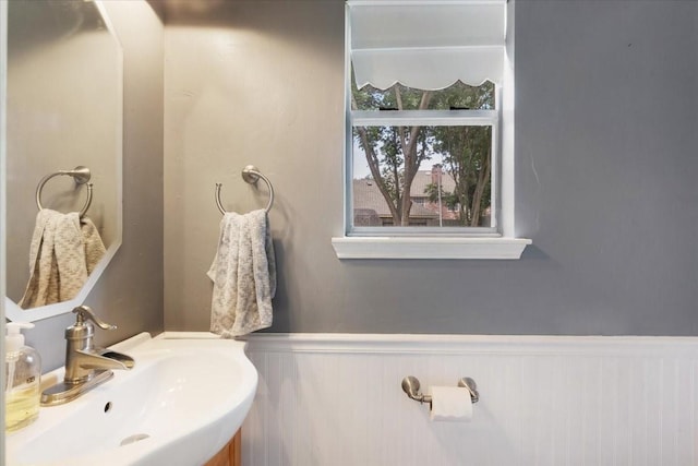 4910 Bayfair St, Pasadena, TX 77505 - bathroom with a sink and wainscoting