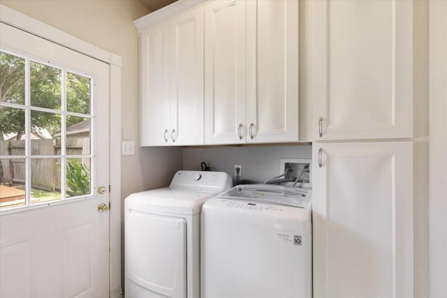 4910 Bayfair St, Pasadena, TX 77505 - laundry room with cabinet space and washer and dryer