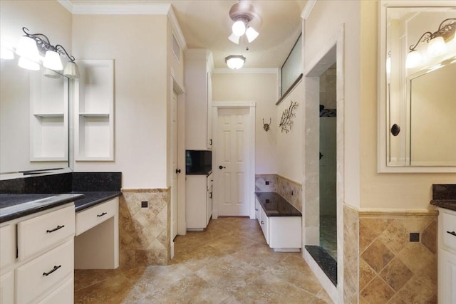 4910 Bayfair St, Pasadena, TX 77505 - full bathroom featuring tile walls, ornamental molding, a tile shower, a garden tub, and a wainscoted wall