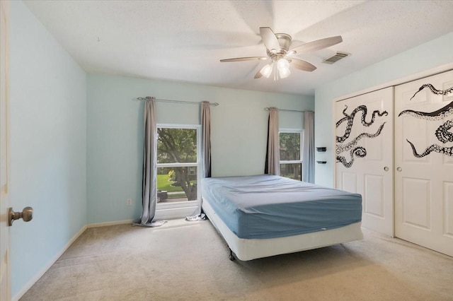 4910 Bayfair St, Pasadena, TX 77505 - carpeted bedroom featuring multiple windows and ceiling fan