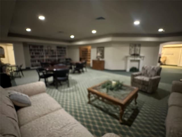 2815 Kings Crossing Dr Unit 308, Houston, TX 77345 - living area featuring a raised ceiling, carpet floors, and recessed lighting