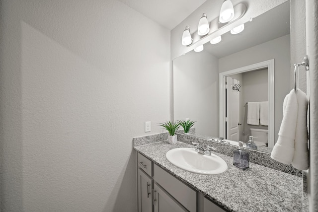 7410 Arabian Moon Trl, Fulshear, TX 77441 - bathroom featuring vanity and a textured wall
