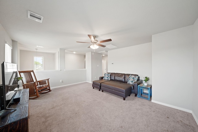 7410 Arabian Moon Trl, Fulshear, TX 77441 - living area featuring carpet, a ceiling fan, and baseboards