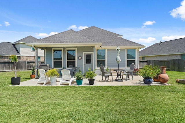 7410 Arabian Moon Trl, Fulshear, TX 77441 - back of house featuring a patio area and a shingled roof