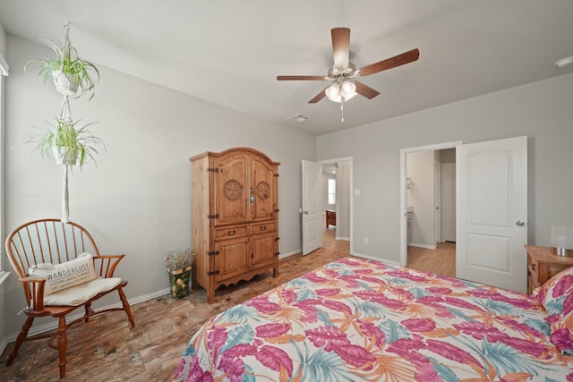 7410 Arabian Moon Trl, Fulshear, TX 77441 - bedroom featuring baseboards and light wood finished floors