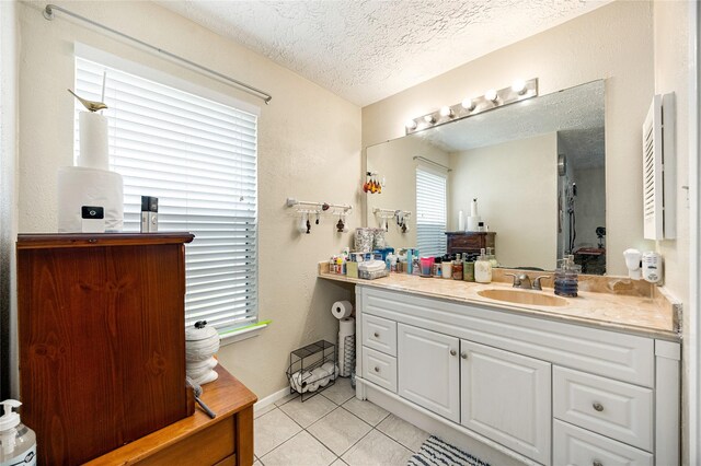 16307 Thistleglen Dr, Houston, TX 77095 - bathroom featuring tile patterned floors, vanity, and a textured ceiling
