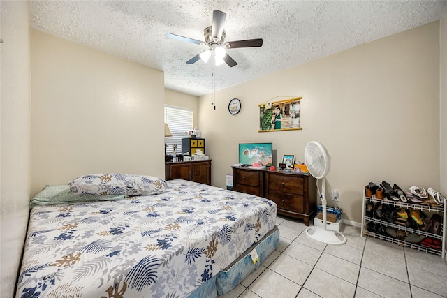 16307 Thistleglen Dr, Houston, TX 77095 - bedroom with a textured ceiling, light tile patterned floors, a ceiling fan, and baseboards