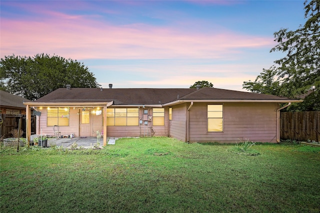 16307 Thistleglen Dr, Houston, TX 77095 - back of house at dusk with a patio