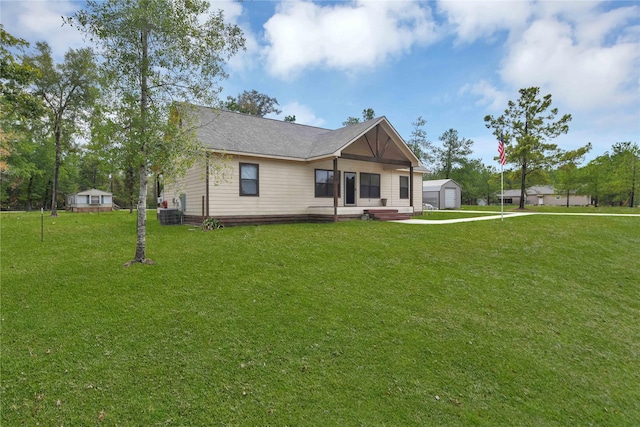 711 Forest Spgs, Livingston, TX 77351 - view of front of house with a front yard, a detached garage, and cooling unit