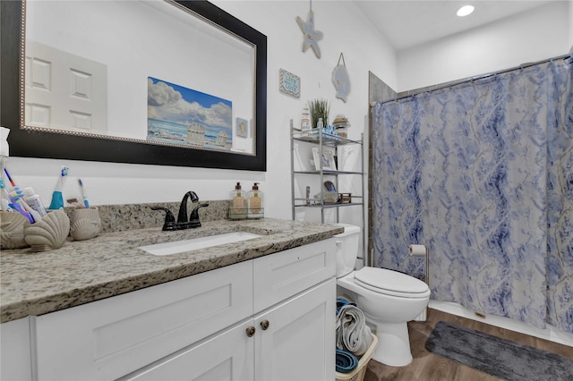 711 Forest Spgs, Livingston, TX 77351 - bathroom with vanity, wood finished floors, toilet, a shower with shower curtain, and recessed lighting