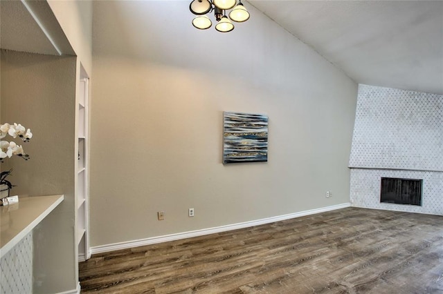 10075 Westpark Dr Unit 45, Houston, TX 77042 - unfurnished living room with dark wood-type flooring, a fireplace, and baseboards