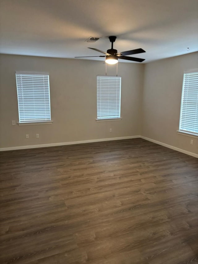 3706 Galway Ln, Houston, TX 77080 - spare room with baseboards, dark wood-type flooring, and a ceiling fan