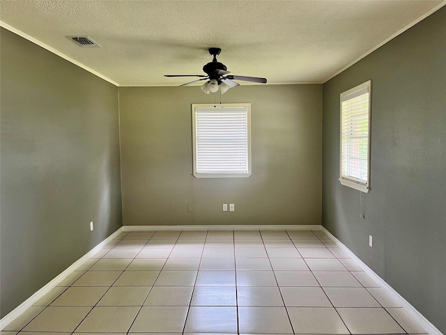 3134 7th Ave N, Texas City, TX 77590 - unfurnished room featuring a textured ceiling, a ceiling fan, crown molding, light tile patterned floors, and baseboards