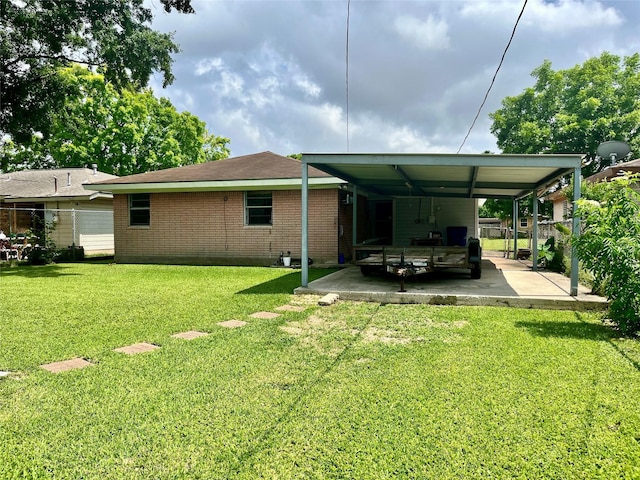 3134 7th Ave N, Texas City, TX 77590 - rear view of house with an attached carport and brick siding