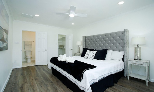 5313 De Lange Ln, Houston, TX 77092 - bedroom with crown molding, dark wood finished floors, a spacious closet, baseboards, and recessed lighting