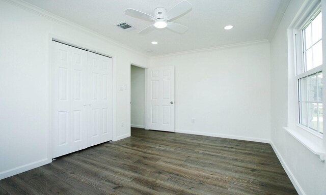 5313 De Lange Ln, Houston, TX 77092 - unfurnished bedroom with ornamental molding, dark wood-type flooring, multiple windows, baseboards, and recessed lighting