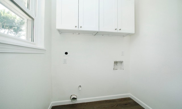 5313 De Lange Ln, Houston, TX 77092 - laundry room featuring electric dryer hookup, baseboards, cabinet space, washer hookup, and dark wood-type flooring