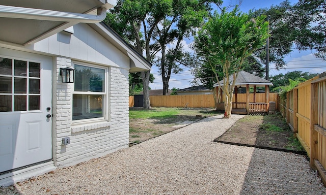 5313 De Lange Ln, Houston, TX 77092 - fenced backyard featuring a gazebo and a patio area