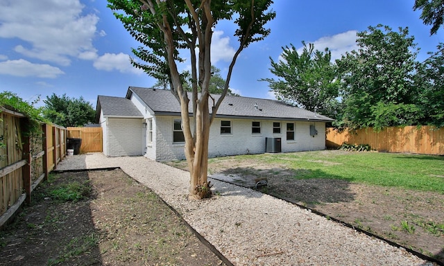 5313 De Lange Ln, Houston, TX 77092 - rear view of property featuring brick siding, a fenced backyard, and a patio