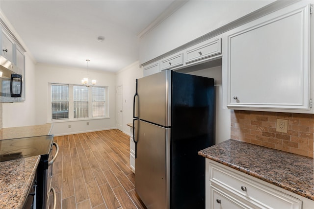 5515 Strack Rd Unit 101, Houston, TX 77069 - kitchen with stainless steel appliances, ornamental molding, light wood-type flooring, backsplash, and a chandelier