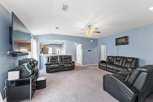 14135 Chelseahurst Ln, Houston, TX 77047 - carpeted living room with arched walkways, ceiling fan, lofted ceiling, and baseboards