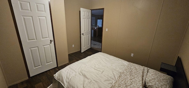 114 Dolphin Hbr N, Baytown, TX 77523 - bedroom featuring dark wood finished floors and baseboards