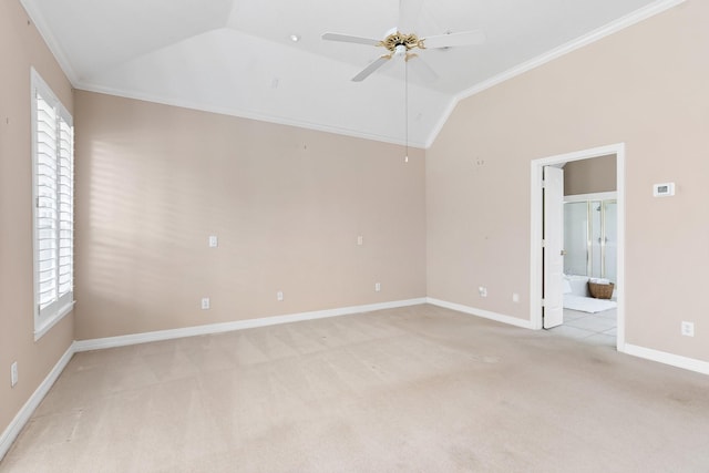 12027 Water Oak Dr, Magnolia, TX 77354 - spare room featuring light carpet, vaulted ceiling, a ceiling fan, ornamental molding, and baseboards