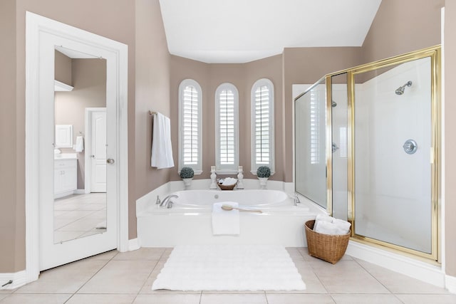 12027 Water Oak Dr, Magnolia, TX 77354 - full bathroom featuring a shower stall, a bath, tile patterned floors, and baseboards